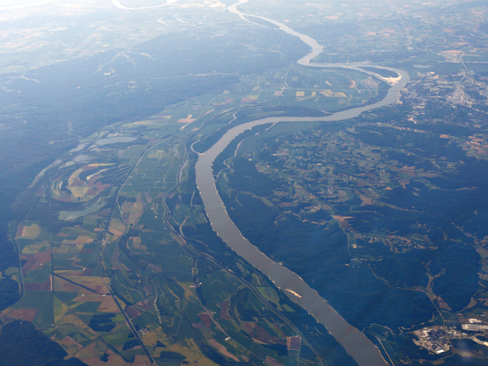 Aerial view of Mississippi River snaking around farmlands in Louisiana