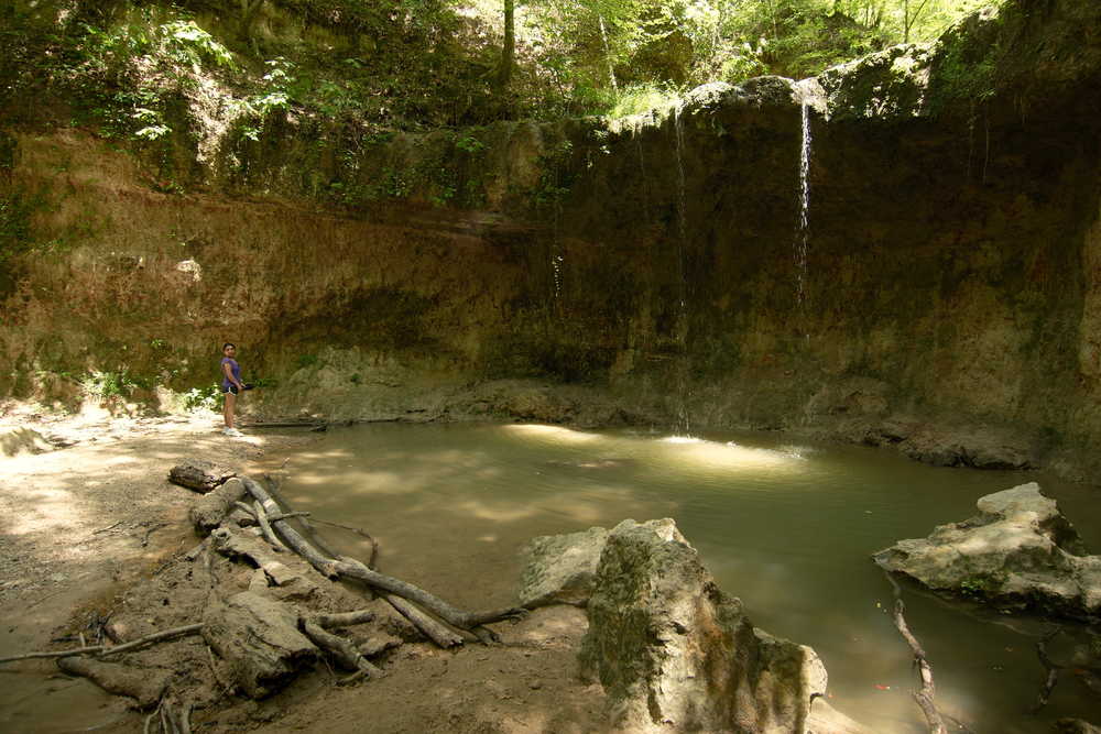 Tunica Hills, Mississippi, USA - 2019: A woman enjoys a summer day at Clark Creek Natural Area.