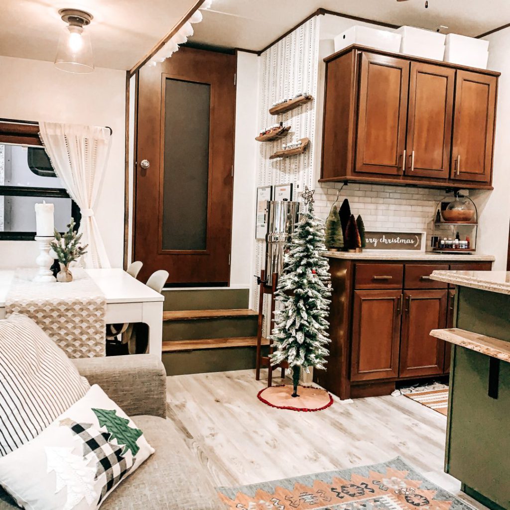Interior of a fifth-wheel RV kitchen decorated for winter Christmas
