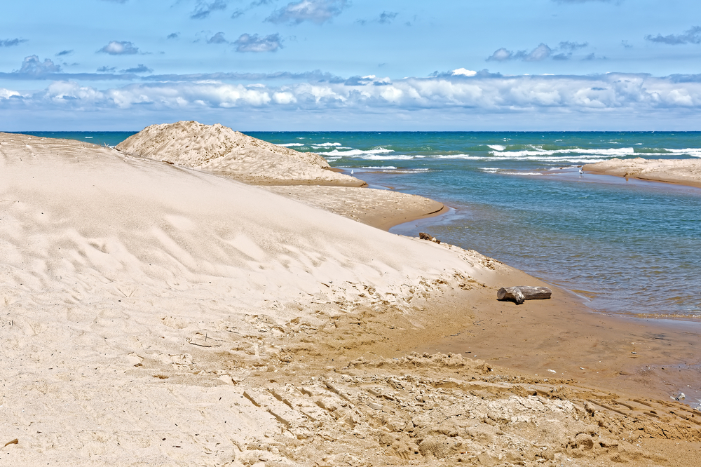 Indiana Dunes National Lakeshore is a National Park on Lake Michigan's south shore. The sand dunes make this beach a popular tourist attraction in Indiana, USA.