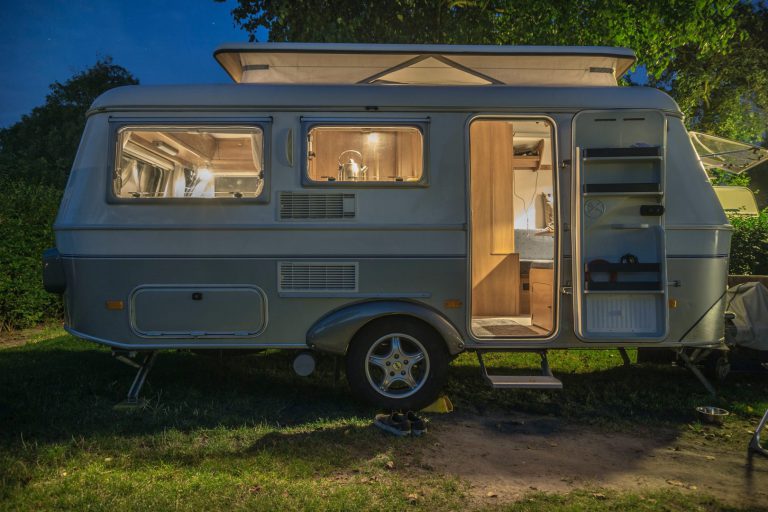 Small trailer parked with lights on