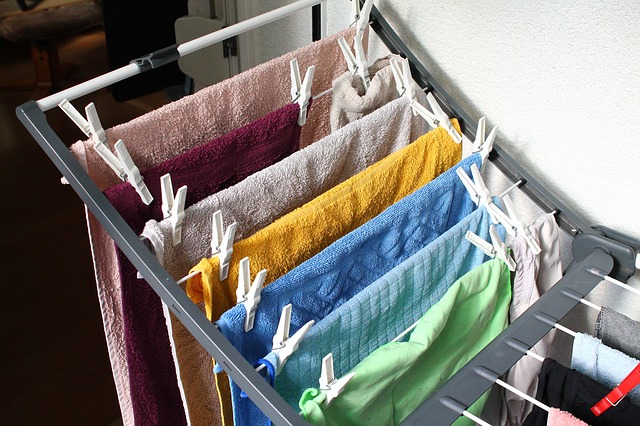 a drying rack with hand towels on it