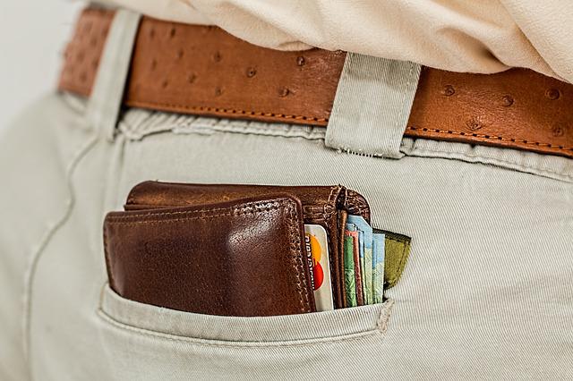 man with credit cards in wallet