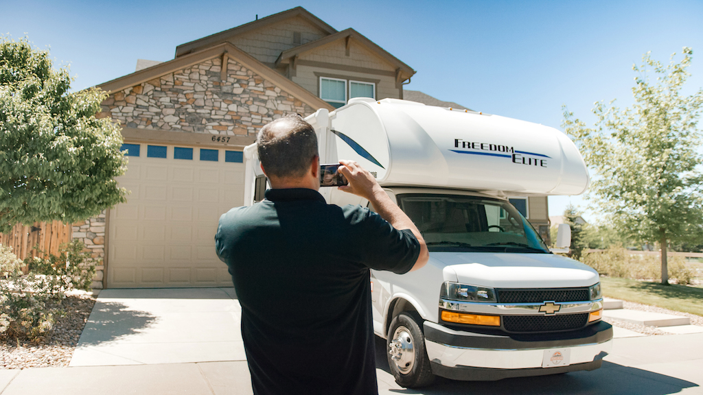 rv owner taking picture of RV