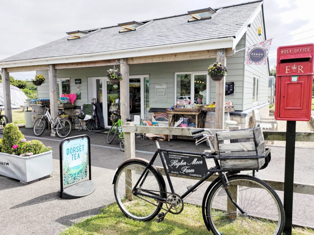 bicycle parked outside small tea shop at a campground in england