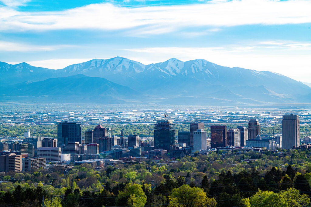 skyline of salt lake city, utah with mountains in the distance