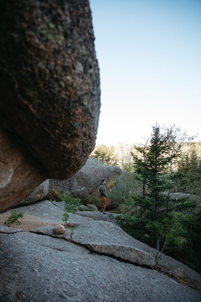 man climbing on boulders at Vedauwoo Climbing Area