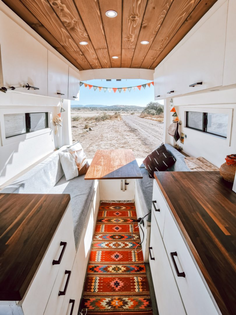 bench seating in an rv with the back door open