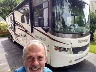 man standing in front of an rv