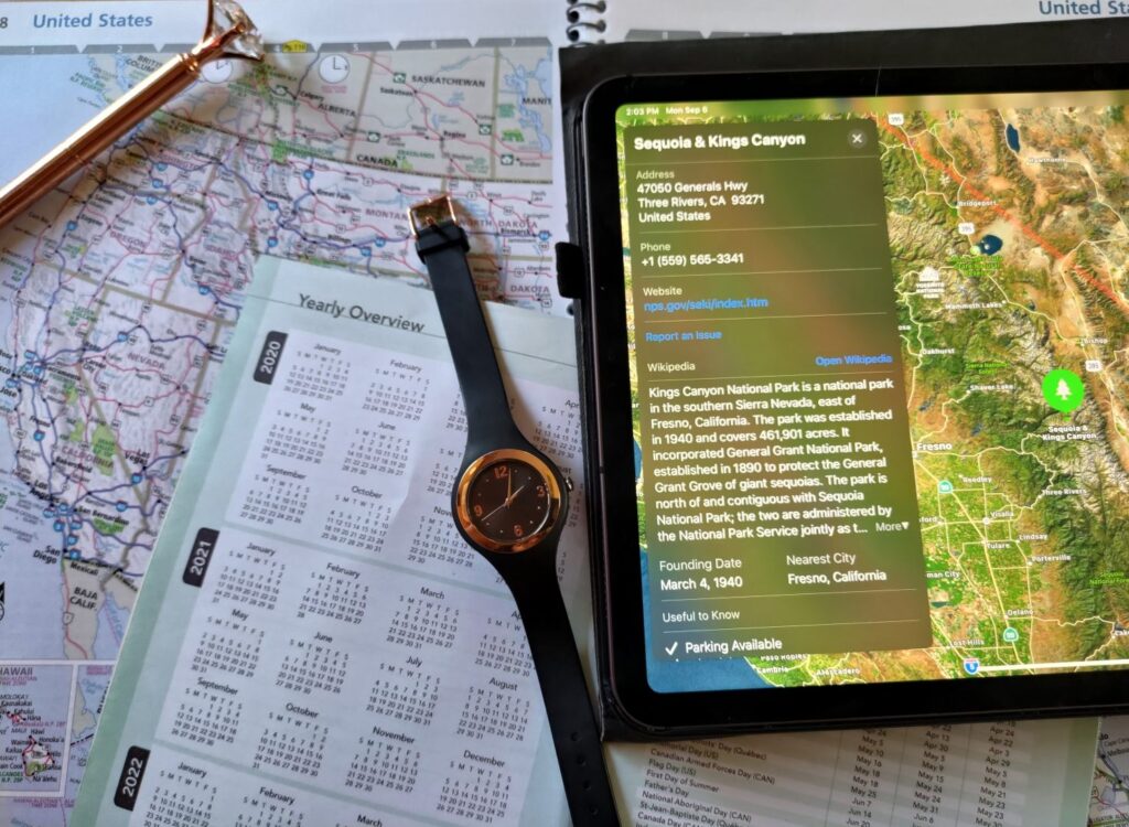 Watch, maps, and tablet with google map to plan trip