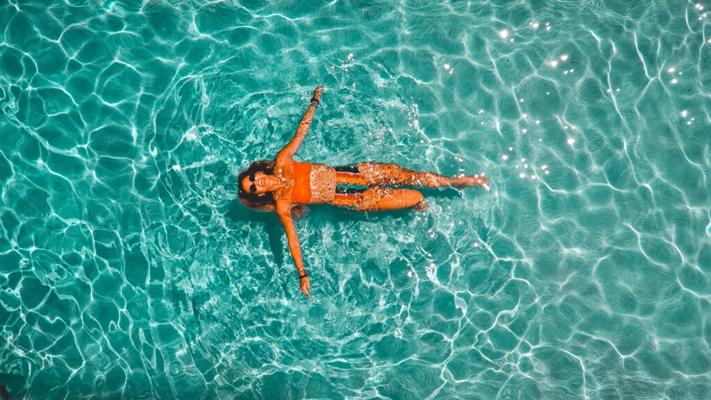Lady floating in pool