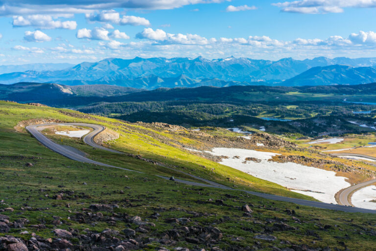 Beartooth Highway in Montana, winding through mountains and past snow