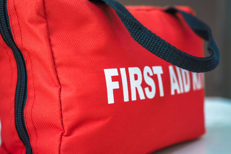 A First Aid kit in a red bag