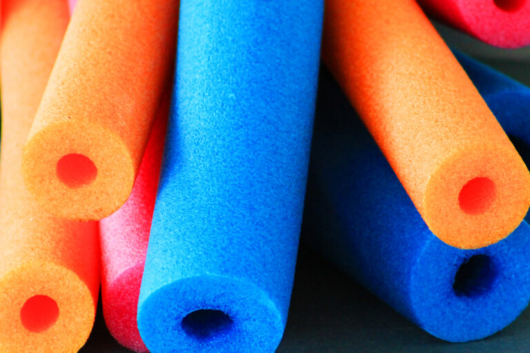 A close-up picture of colorful pool noodles