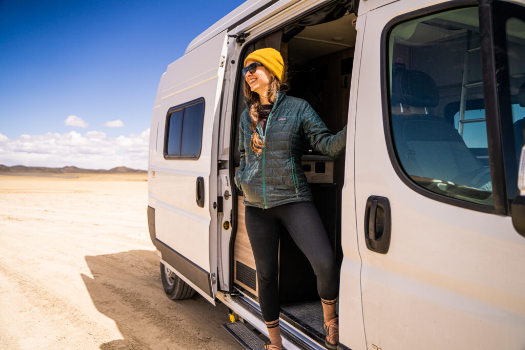 woman stepping out of a camper van