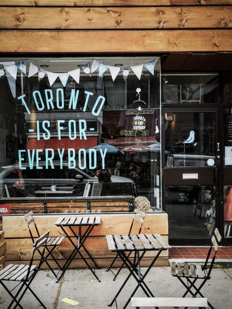 Restaurant window that reads 'Toronto is for everybody'