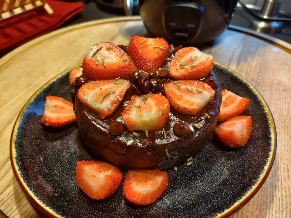 Homemade brownie topped with strawberries