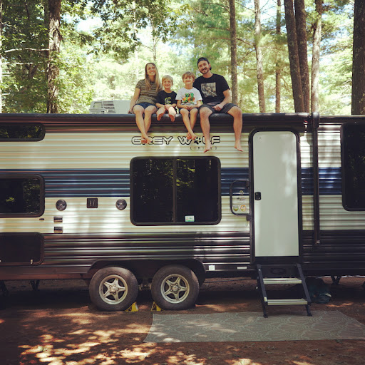 family with their travel trailer