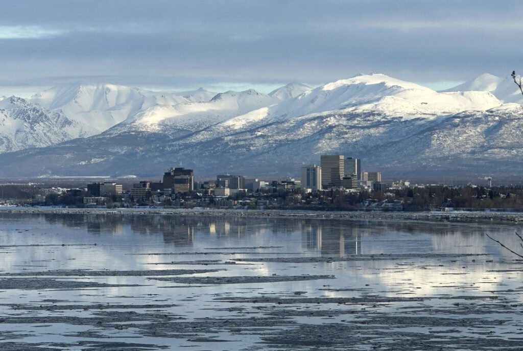 views of Anchorage and the mountains behind from the Earthquake Park Trail