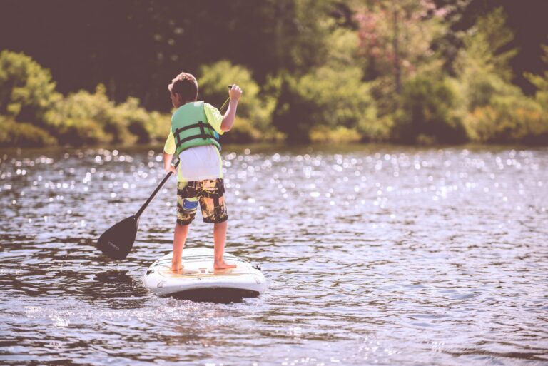 Kid on a kayak while camping
