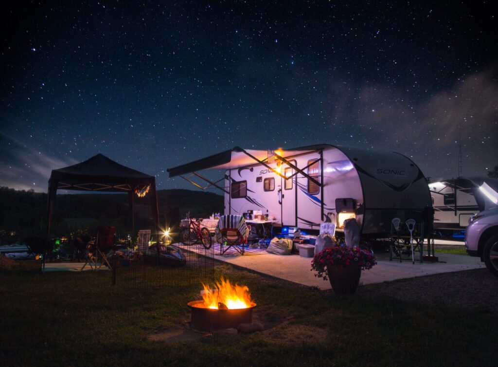 Camper trailer in a campsite at night