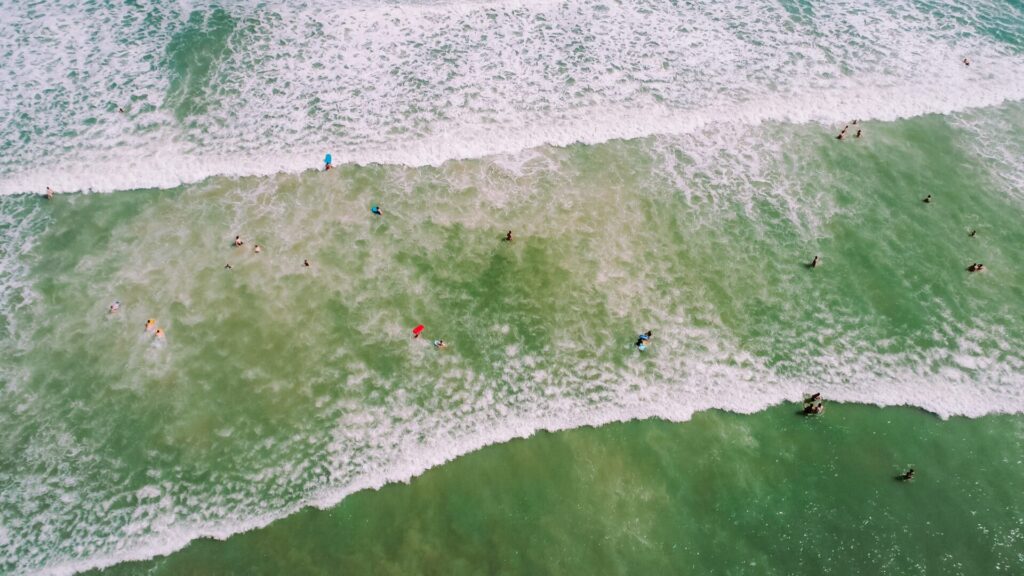 Eagles eye view of people surfing at Cocoa Beach