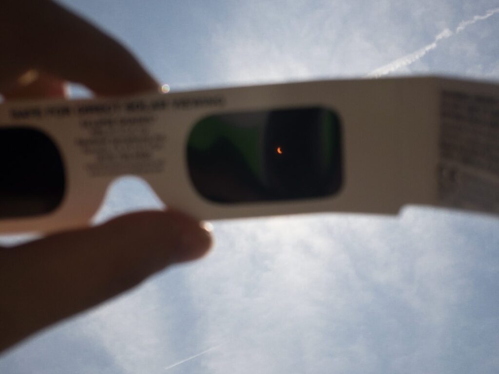 Solar eclipse through viewing glasses