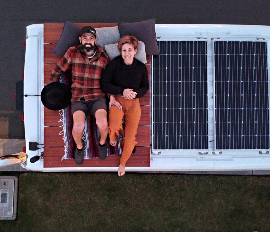 solar panels and couple in the roof of van