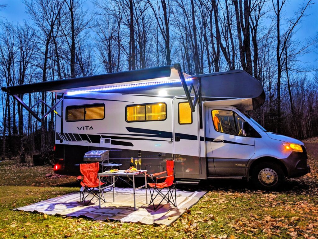 RV parked in front of trees