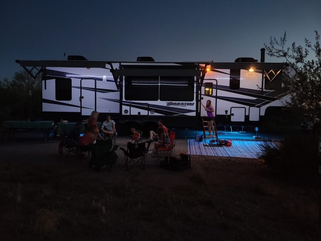 Family enjoying their RV rental delivery after dark