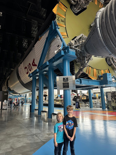 two kids exploring an air museum
